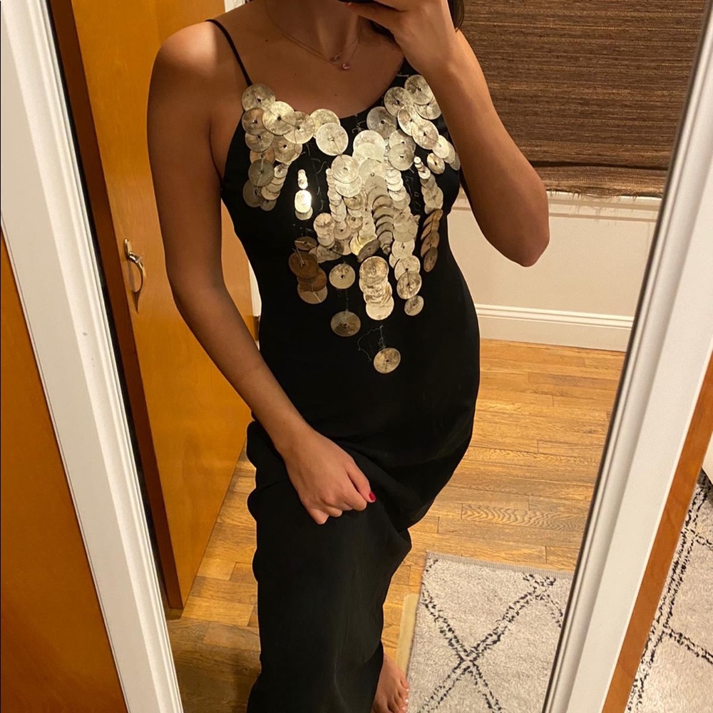 Mao Black maxi gown for weddding with gold detail.